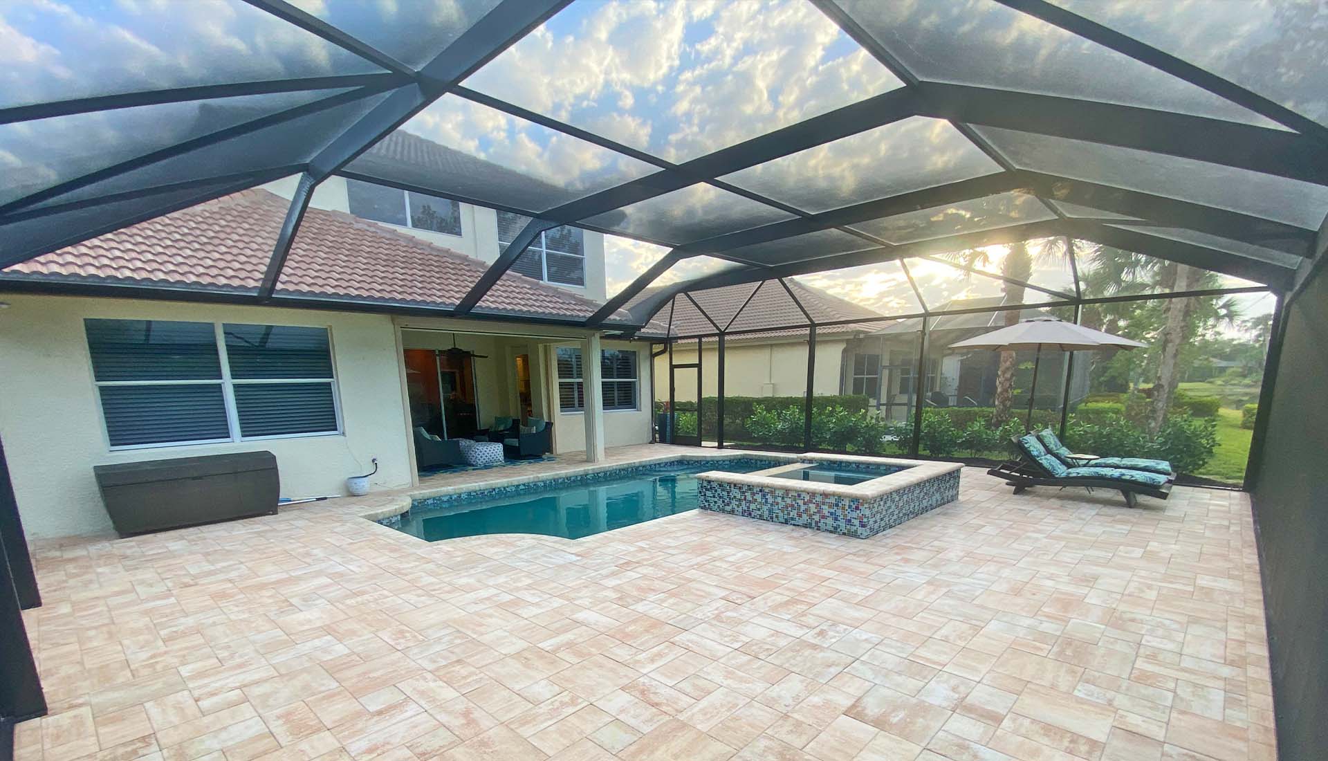 7 - Photo of Cement Pavers, glass tiles and screen enclosure - Pool and Deck Concepts, Naples, FL