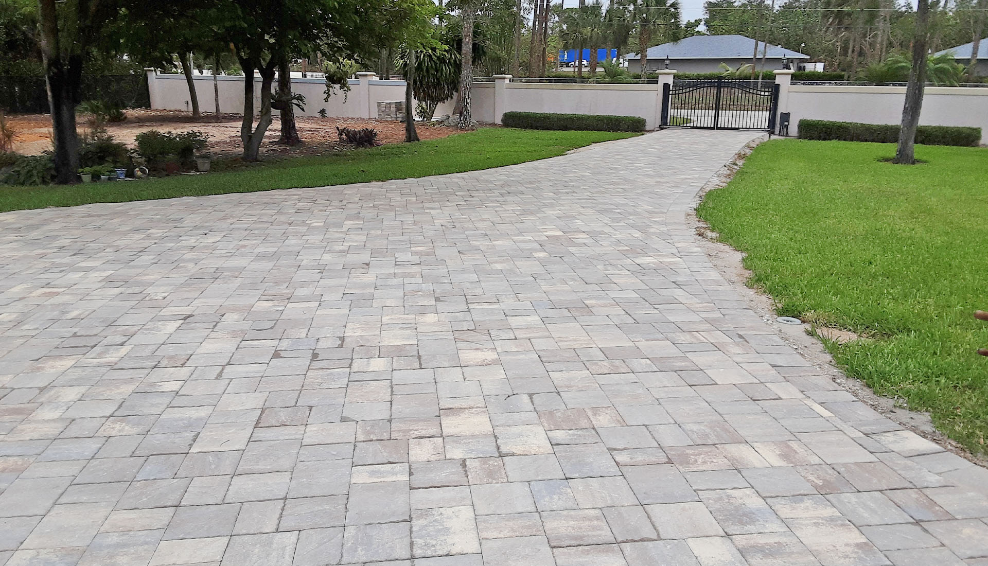 Long Cement Paver Driveway by Pool and Deck Concepts