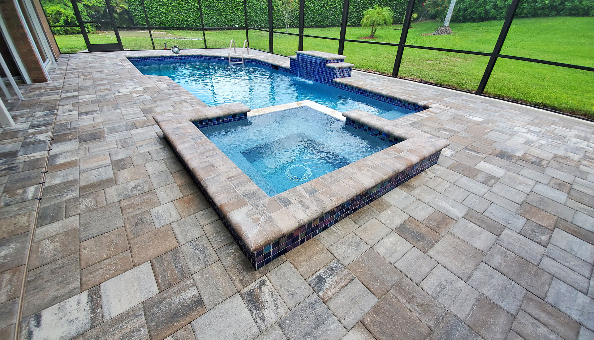 Cement Paver swimming pool decking by Pool and Deck Concepts