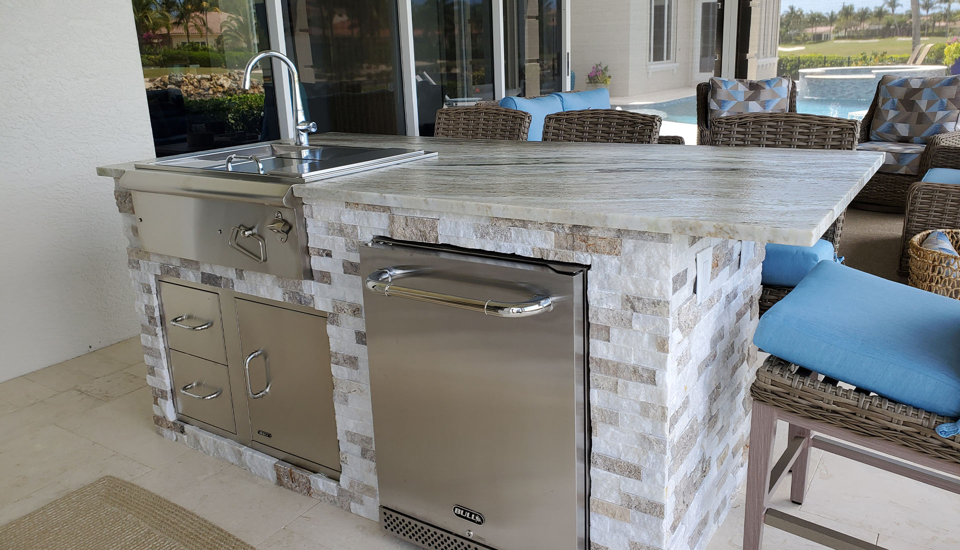 Complete Outdoor Kitchen #1 design with island, grill and fridge by Pool and Deck Concepts